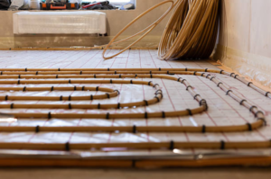 On-site Installation Service for Residential Hydronic Underfloor Heating – Gold-Colored Piping System